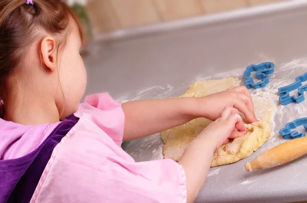 stock image Little girl works with the dough in the kitchen
