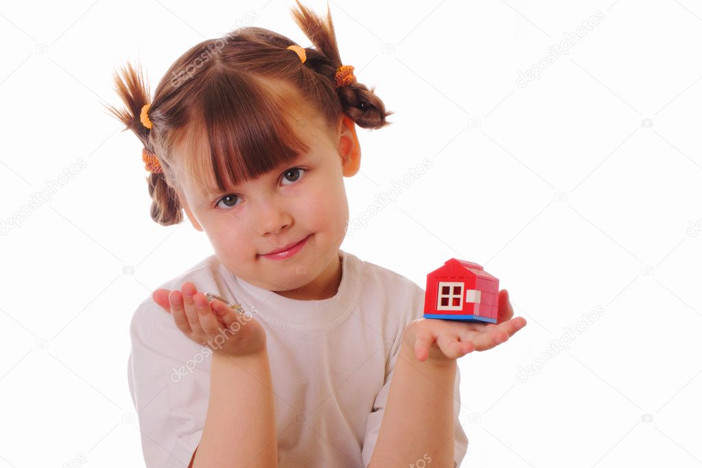 Little girl with a key and a house in her hands