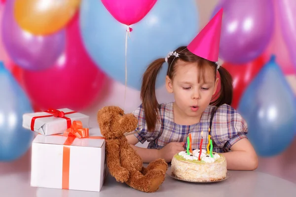 Little girl blows out the candles — Stock Photo, Image