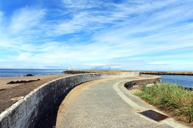 Girvan, Scotland, a pier leading to the old lightouse clipart