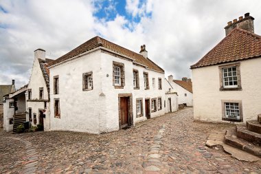 Old street and historical houses in Culross, Scotland clipart