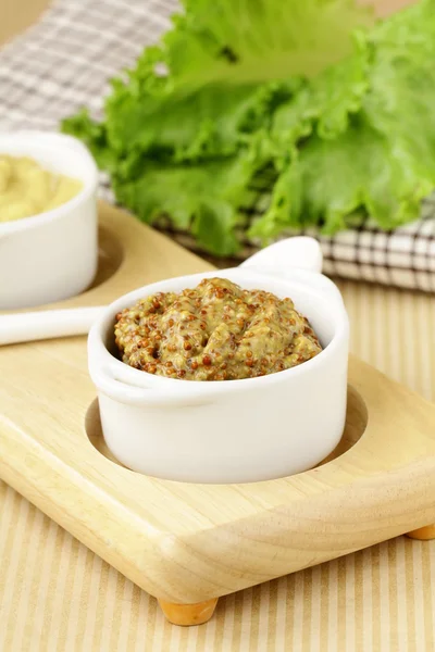 stock image French mustard sauce in white gravy boat