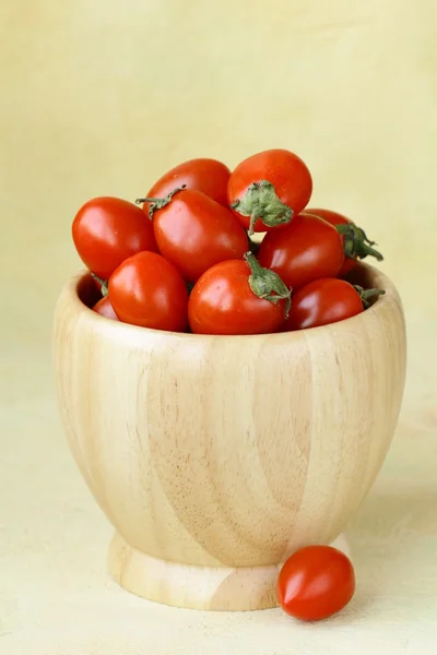 stock image Small cherry tomatoes in a wooden bowl