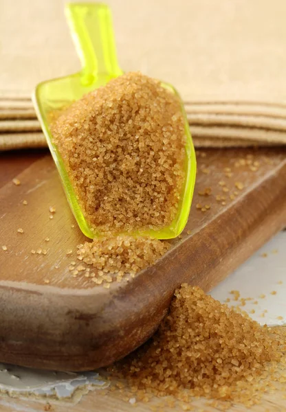 stock image Cane sugar in spoon on a wooden board