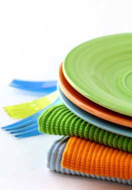 Colorful plate and napkins for picnics clipart