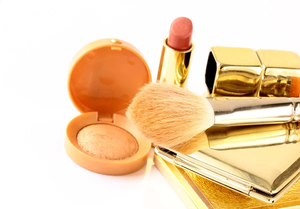 Gold make up collection on white background — Stock Photo, Image