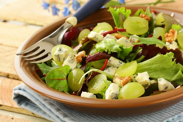 stock image Mix salad with grapes and walnuts with blue cheese