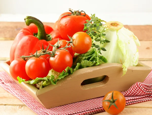 Different fresh vegetables in a wooden bowl — Stock Photo, Image