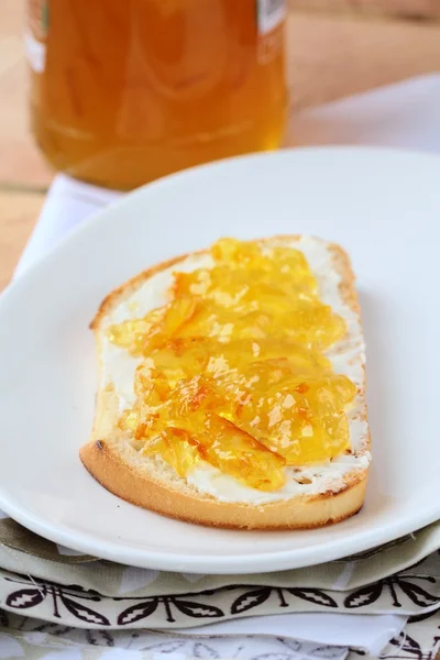 Orange jam with toast on plate — Stock Photo, Image