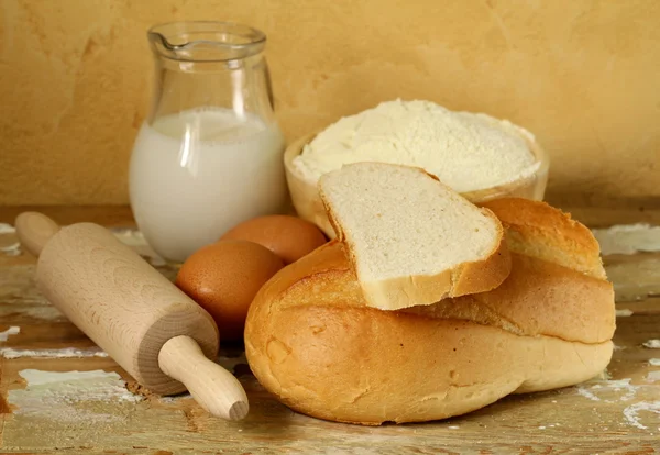 Still life - bread, milk, flour, eggs — Stock Photo, Image
