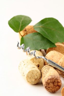 Cork from wine and a corkscrew on white background clipart