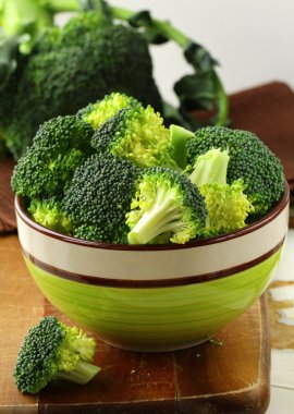 Fresh broccoli on a wooden board clipart