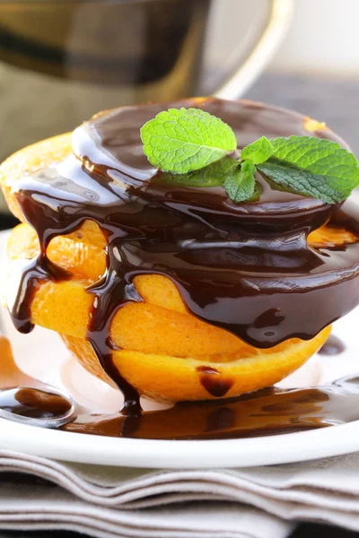 Fresh orange in chocolate sauce - a great dessert — Stock Photo, Image