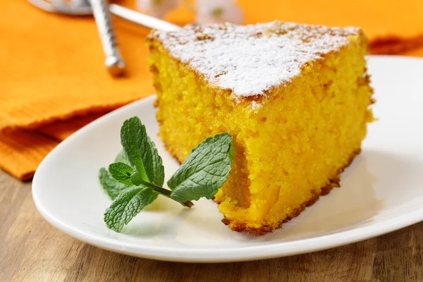 Carrot cake with powdered sugar and mint — Stock Photo, Image