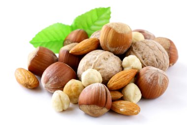 Mix nuts - walnuts, hazelnuts, almonds on a white background clipart