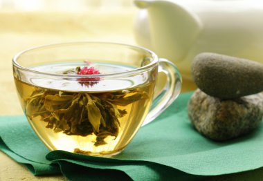 Exotic green tea in the form of a flower clipart