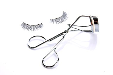 Fake false eyelash with curler clipart