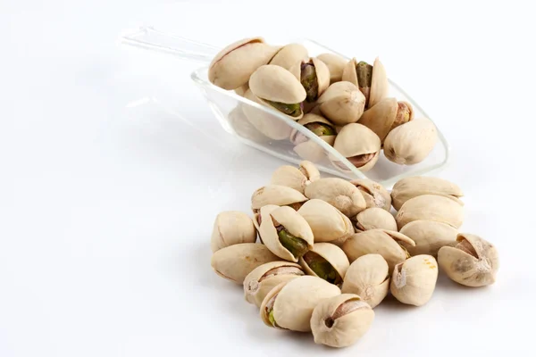 Scoop of roasted and salted pistachios — Stock Photo, Image