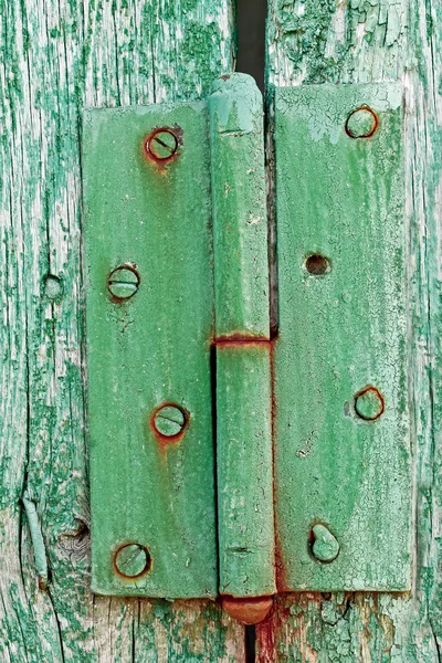 Old hinges on the wooden boards — Stock Photo, Image