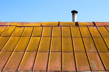 Roof with old metal tile clipart