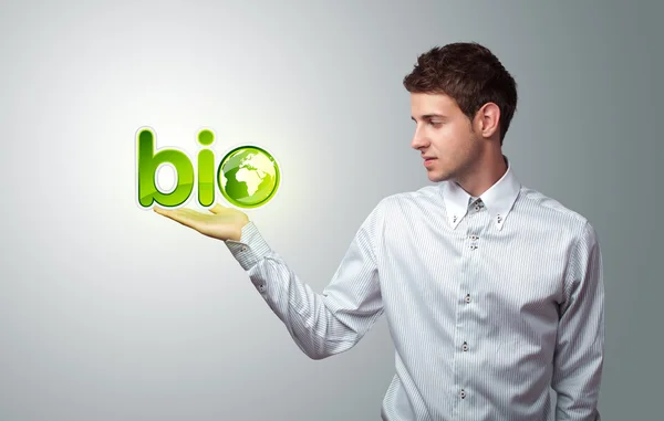 Businessman holding virtual eco sign — Stock Photo, Image