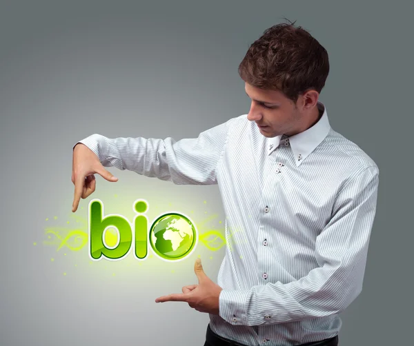 Businessman holding virtual eco sign — Stock Photo, Image