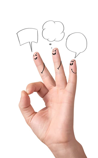 Счастливые пальцы с пузырями речи и знаками — стоковое фото