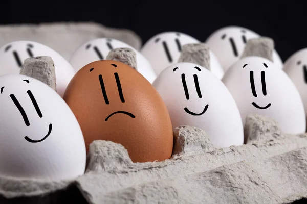Eggs with smiley faces in eggshell — Stock Photo, Image