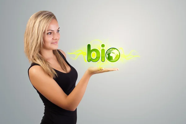 Woman holding virtual eco sign — Stock Photo, Image