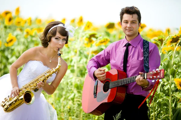 Portrait of bride and groom on sunflower field Royalty Free Stock Photos