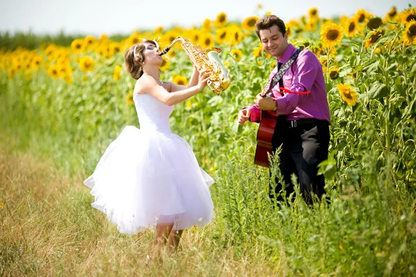 Portrait of bride and groom on sunflower field Stock Photo