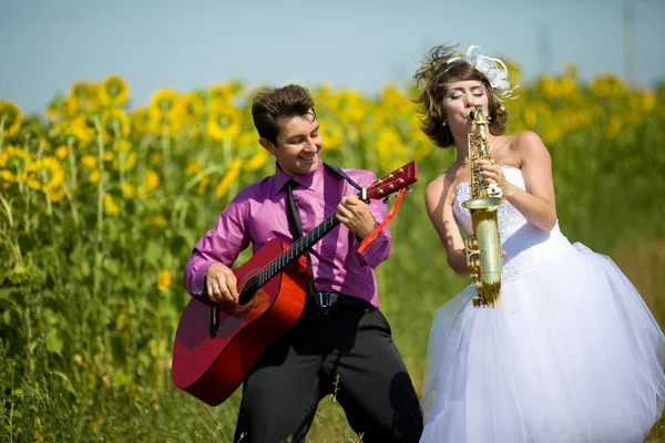 Portrait of bride and groom on sunflower field Royalty Free Stock Images
