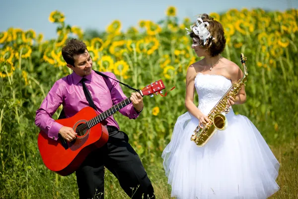 Portrait of bride and groom on sunflower field Stock Photo