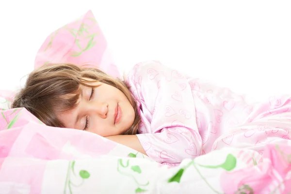 Uma menina deitada na cama — Fotografia de Stock