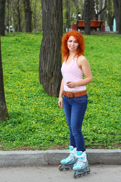 Ginger girl on roller skates — Stock Photo, Image