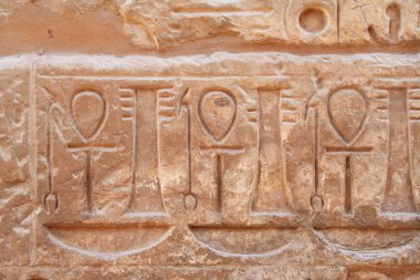 Carvings of ankhs on the wall clipart