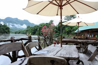 Floating restaurants on the river Kwai in Thailand clipart