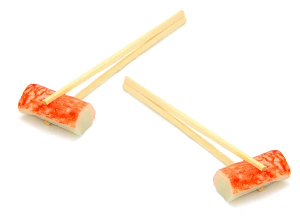 Sushi på chopstick — Stockfoto