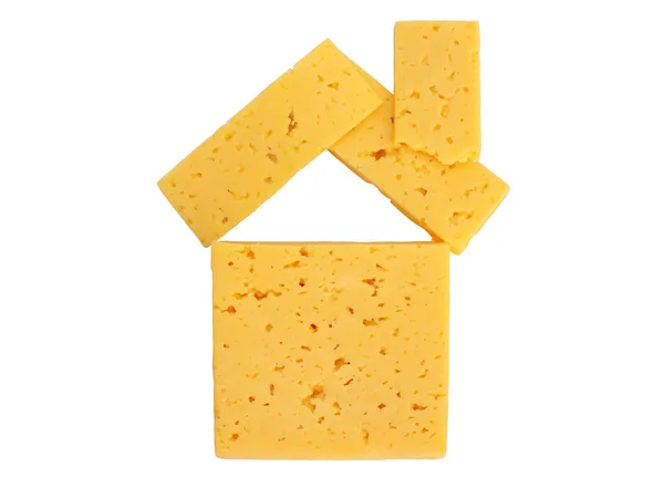 Casa de pedaços de queijo sobre um fundo branco — Fotografia de Stock