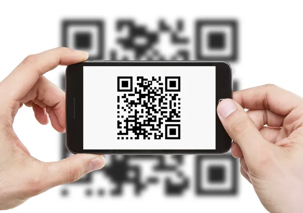 stock image Scanning QR code with smart phone
