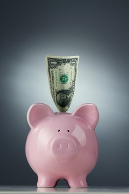 Piggy bank with one dollar bill clipart