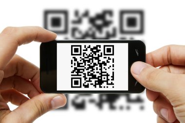 Scanning QR code with mobile phone clipart