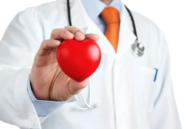 Red rubber heart in doctors hand — Stock Photo, Image