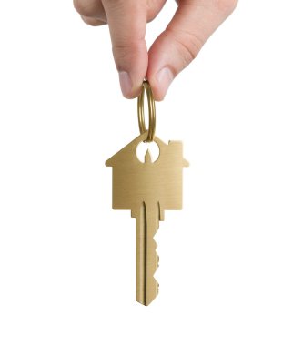Human hand holding gold key clipart