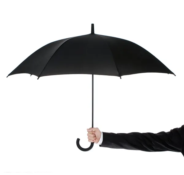 Открытый зонтик в руке человека — стоковое фото