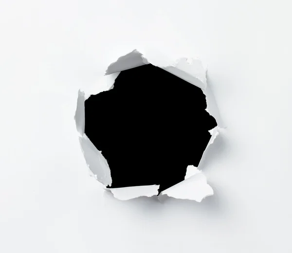 Hole in papier blad — Stockfoto