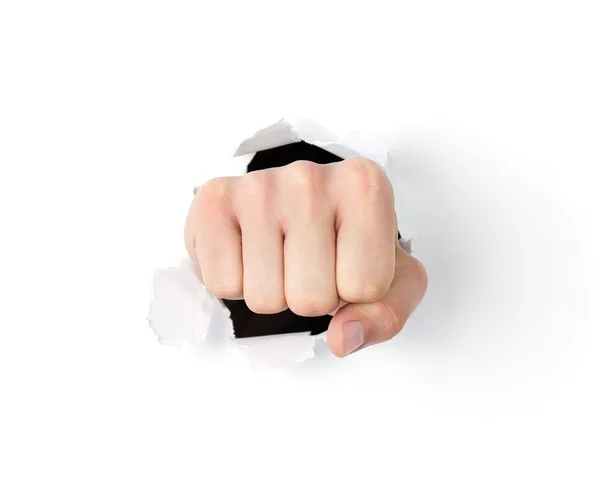 Fist punching through the hole — Stock Photo, Image