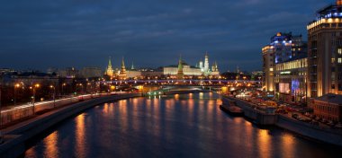 Variety theater and Moscow Kremlin evening view clipart