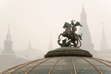 Monument to St. George with Kremlin towers in Moscow clipart