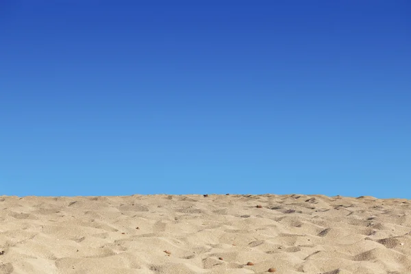 Beach blue sky and sand background